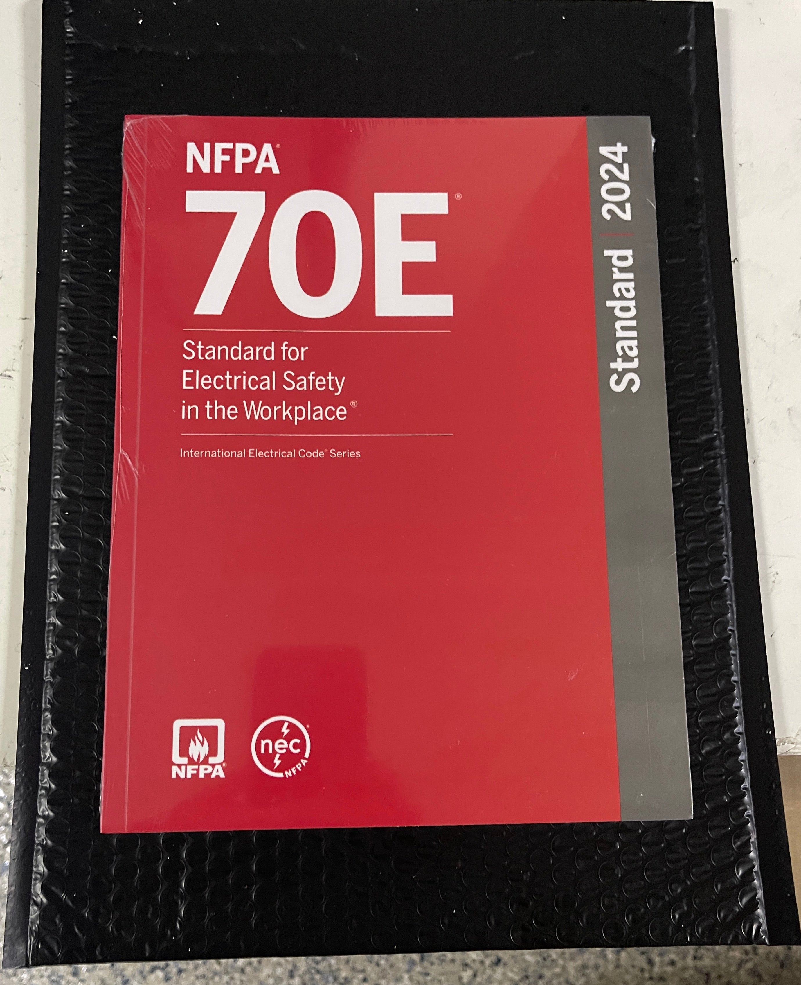 NFPA 70E, Standard for Electrical Safety in the Workplace, 2024 Edition Perfect Paperback + Ugly’s Electrical References, 2023 Edition Spiral-bound