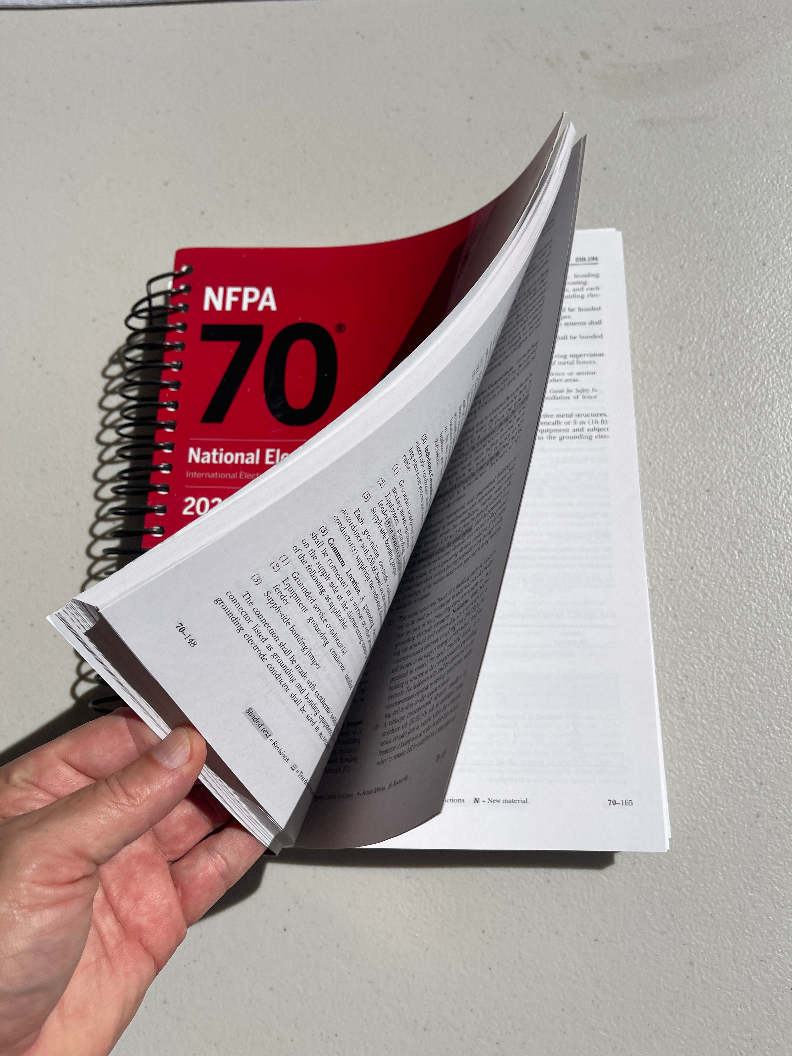 NFPA 70, National Electrical Code, 2023 Edition, Spiralbound With Index Tab + Ugly’s Electrical References, 2023 Edition Spiral-bound