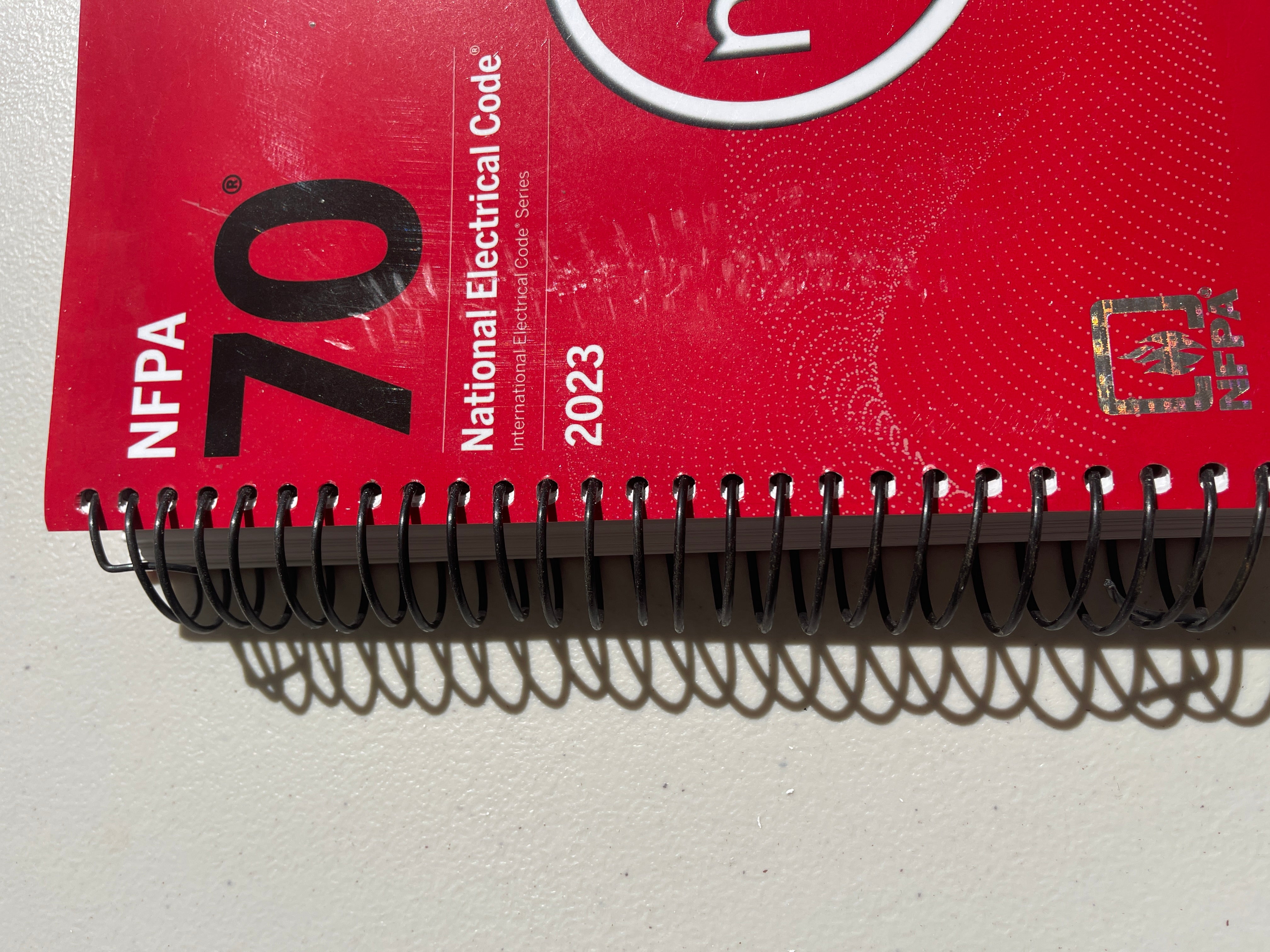 NFPA 70, National Electrical Code, 2023 Edition, Spiralbound With Index Tab + Ugly’s Electrical References, 2023 Edition Spiral-bound