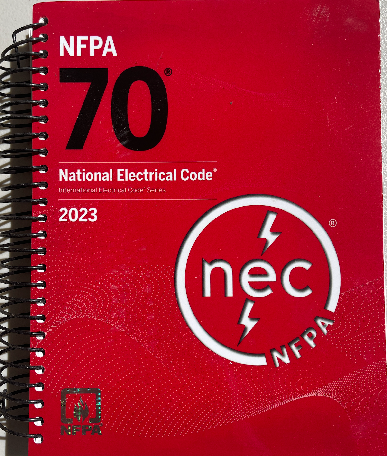 NFPA 70, National Electrical Code, 2023 Edition, Spiralbound With Index Tab + Ugly’s Electrical References, 2023 Edition Spiral-bound